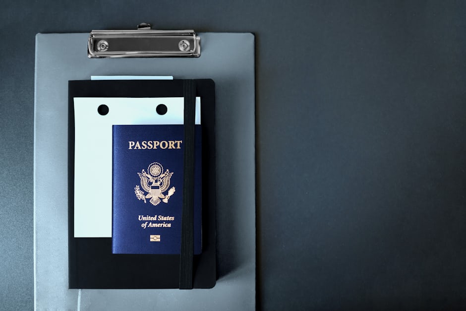 A passport on a clipboard, representing the paperwork of arranging treatment abroad