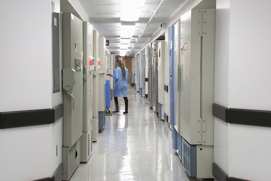 A clinician walking through a hospital corridor, illustrating NHS capacity and waiting times