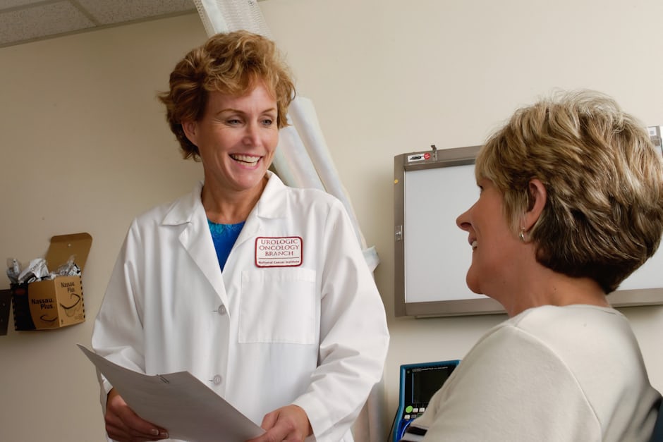 A patient speaking with a doctor about recovery after surgery